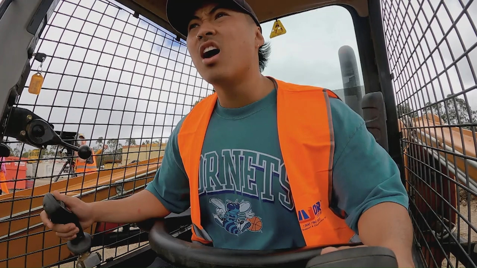 Teng gets a surprise during heavy machinery training