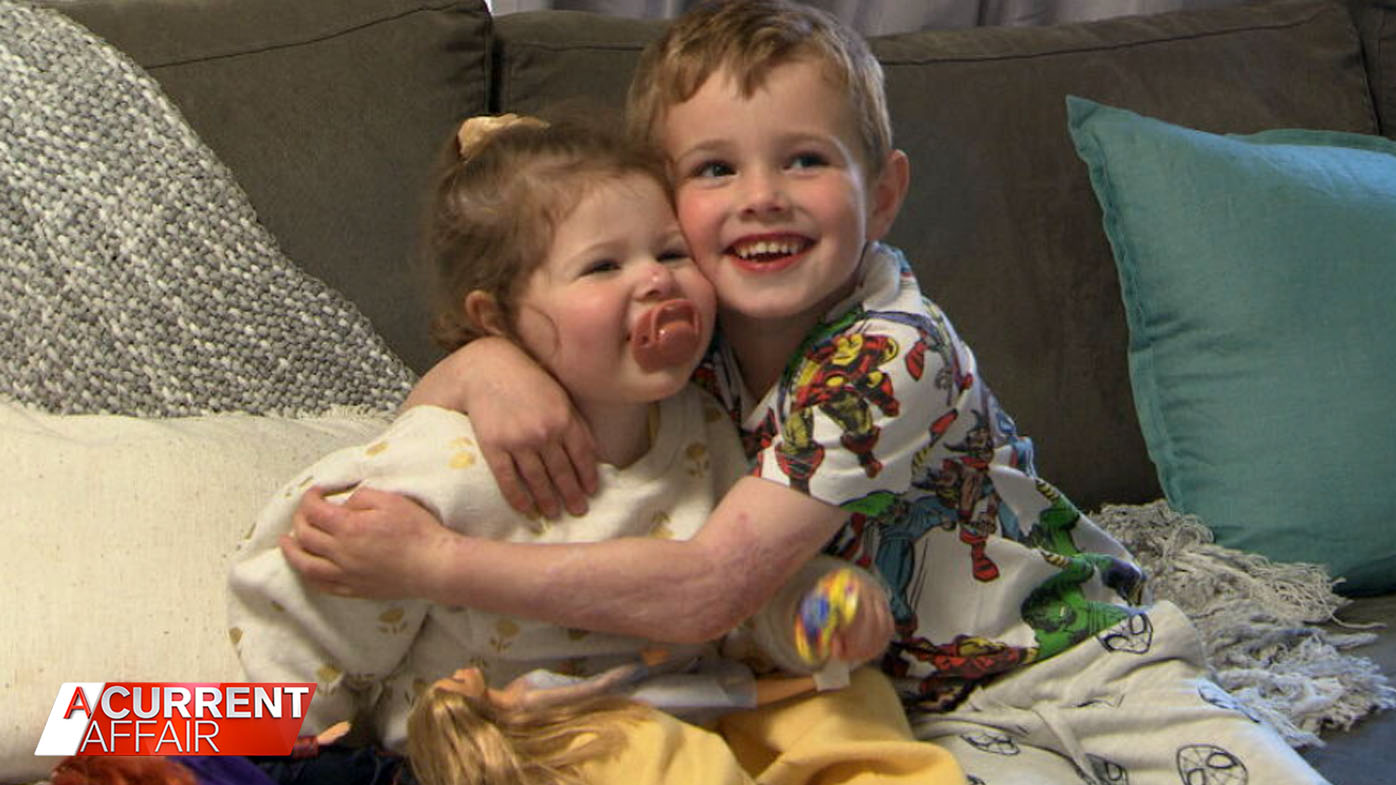 Five-year-old hero saves infant sister from burning cot.