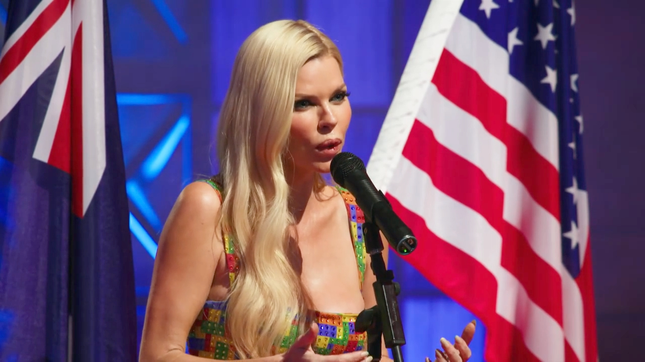 Sophie Monk performs the national anthems of the competing countries